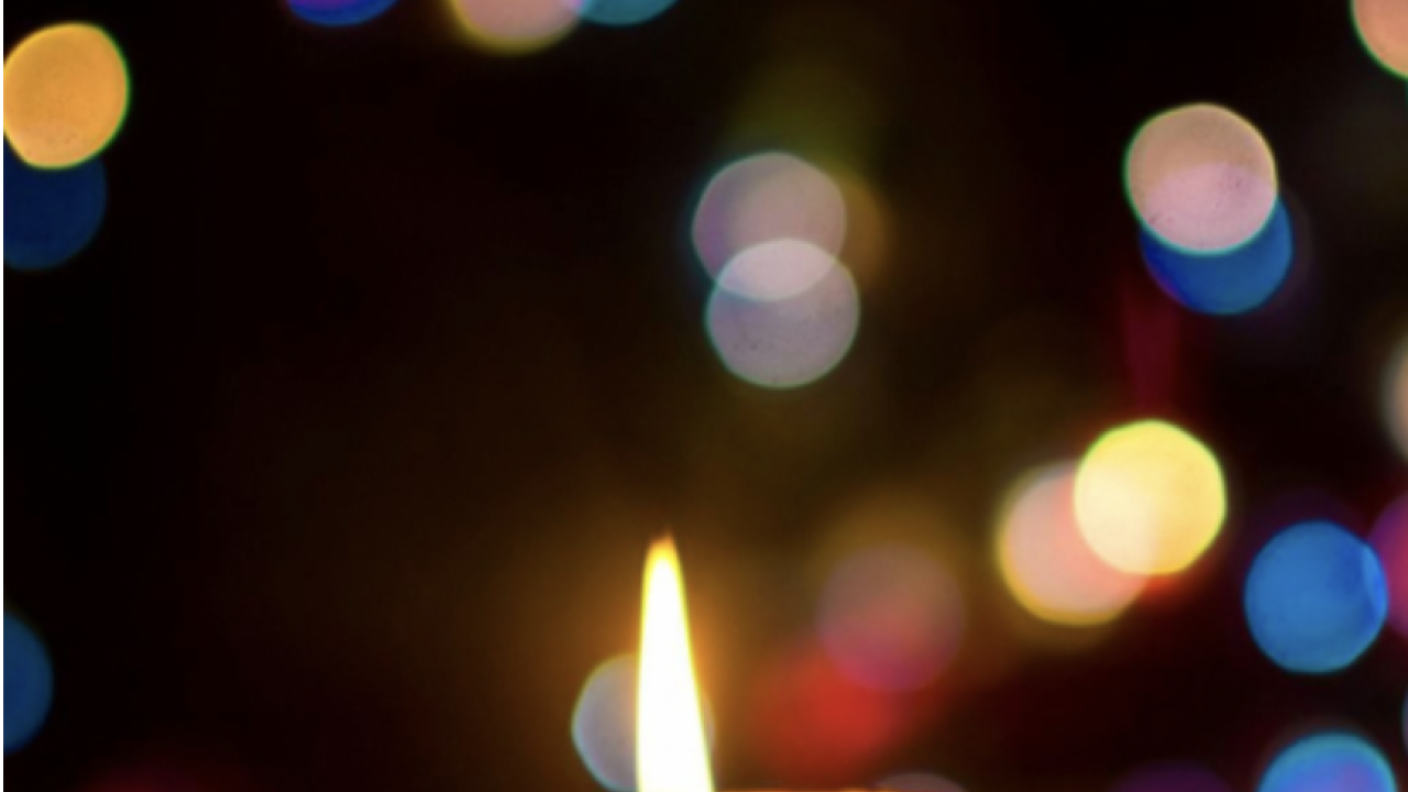 A photo of a candle burning.