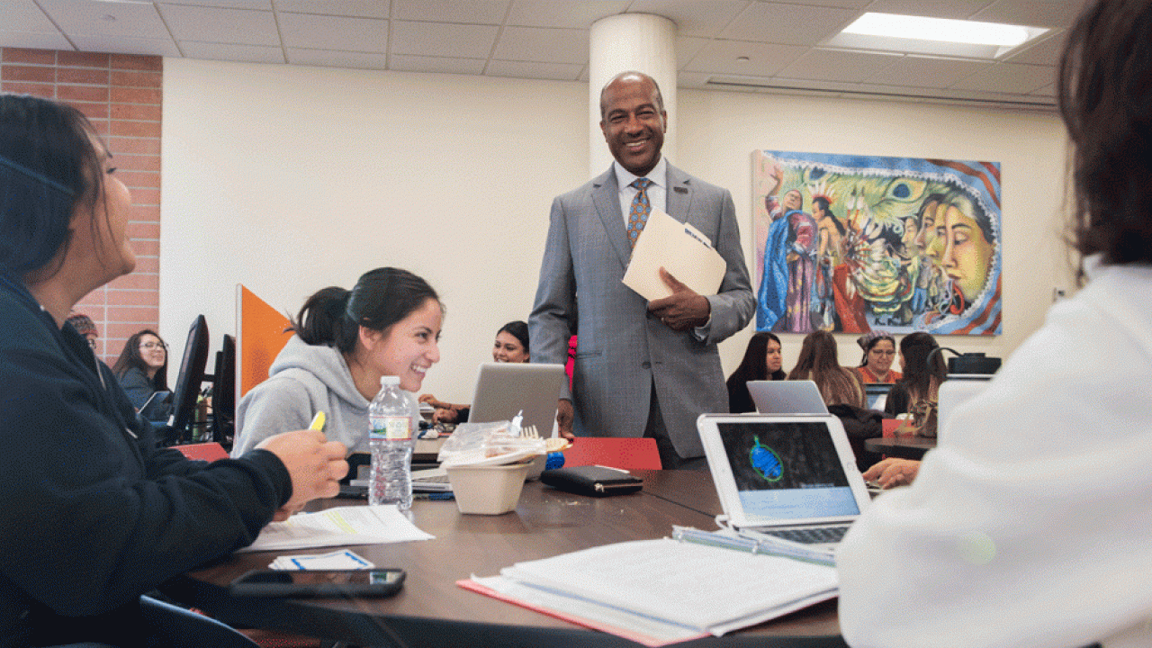 Chancellor Gary S. May visits with students at the Center for Chicanx and Latinx Academic Student Success shortly after it opened in late 2017. Chancellor Gary S. May visits with students at the Center for Chicanx and Latinx Academic Student Success shortly after it opened in late 2017.