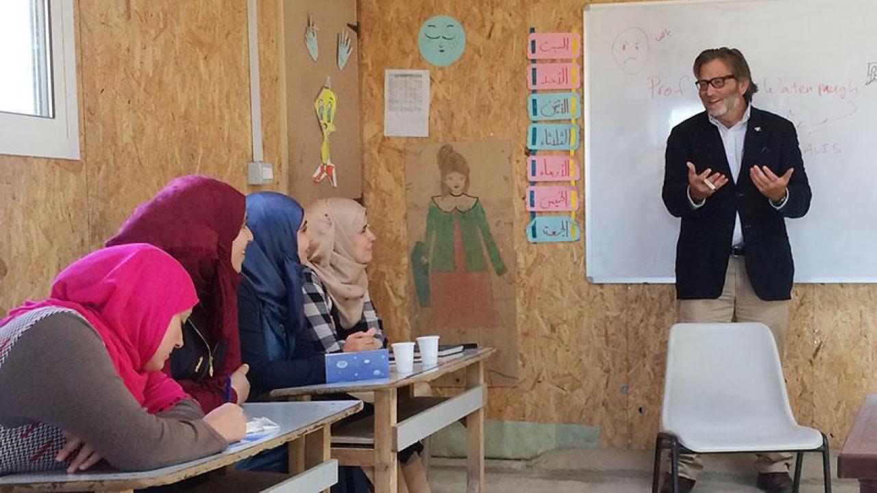 Keith David Watenpaugh, a UC Davis professor, discusses the Article 26 Backpack with Syrian refugees in Lebanon. (Courtesy photo) Keith David Watenpaugh, a UC Davis professor, discusses the Article 26 Backpack with Syrian refugees in Lebanon.