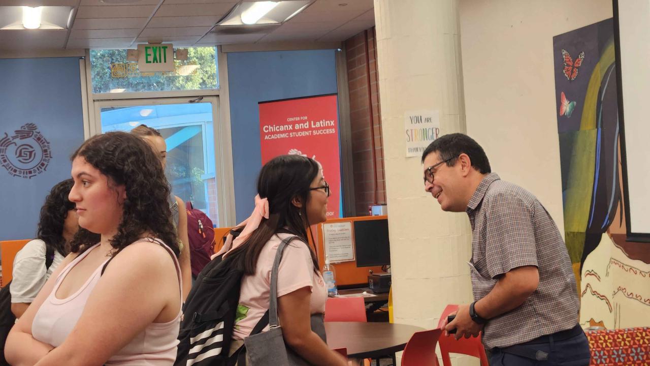 Luis Carvjal-Carmona Speaking with Students