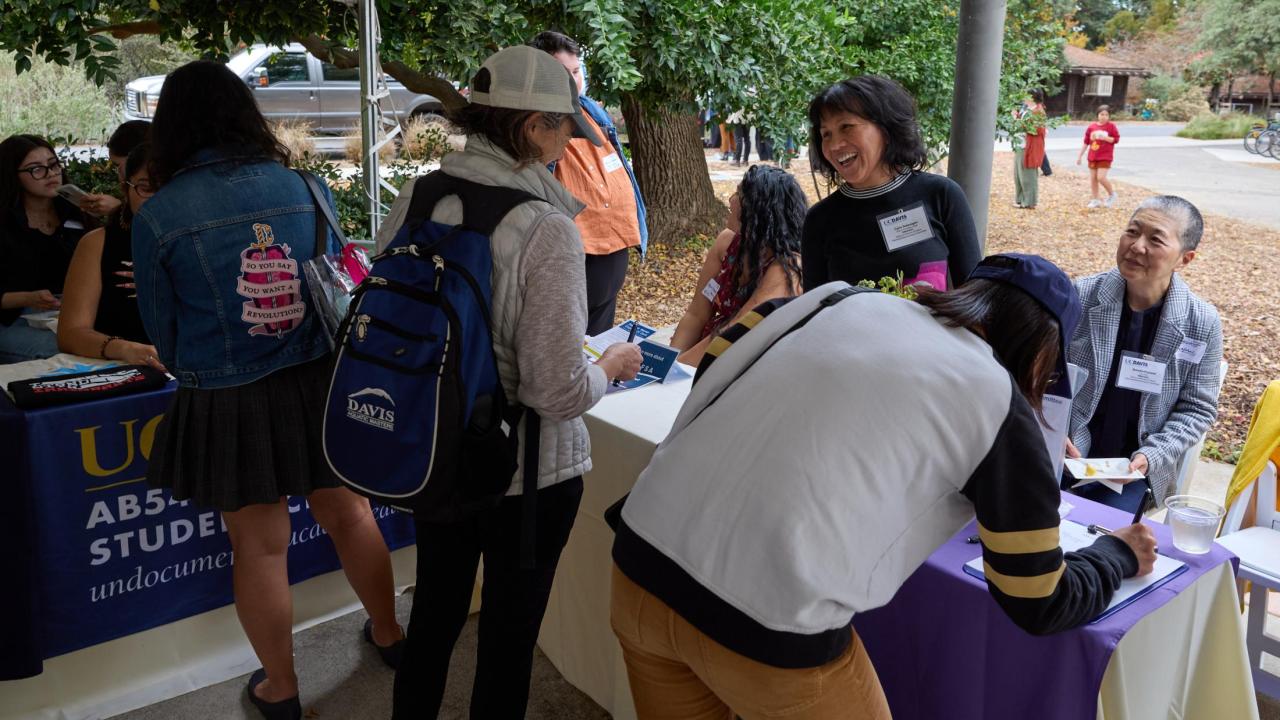 Members of the DEI administrative advisory committee, Status of Women at Davis Administrative Advisory Committee (SWADAAC), tabling at the 2022-24 DEI Fall Harvest Festival.