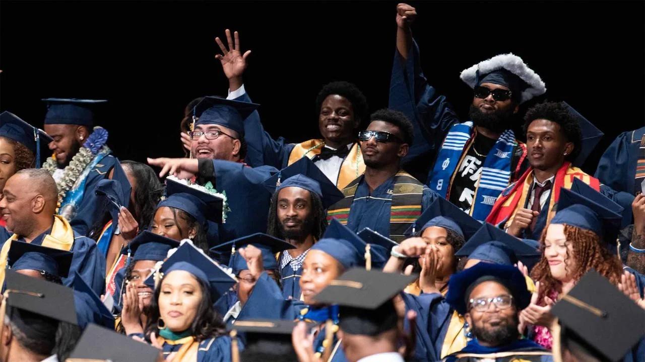 Group of students at black graduation ceremony.