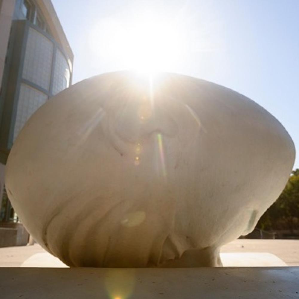 booked sculpture in front of library
