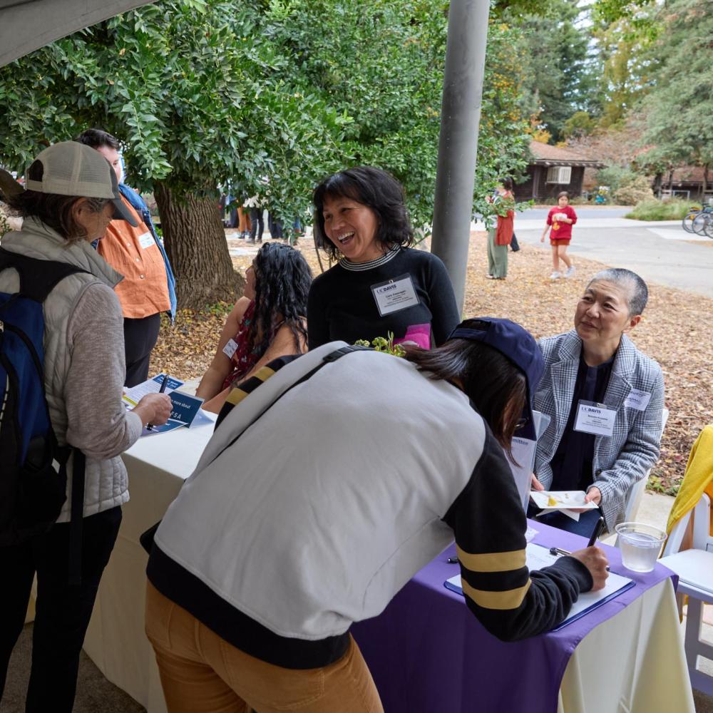 Members of the DEI employee resource group, Status of Women at Davis Administrative Advisory Committee (SWADAAC), tabling at the 2022-24 DEI Fall Harvest Festival.