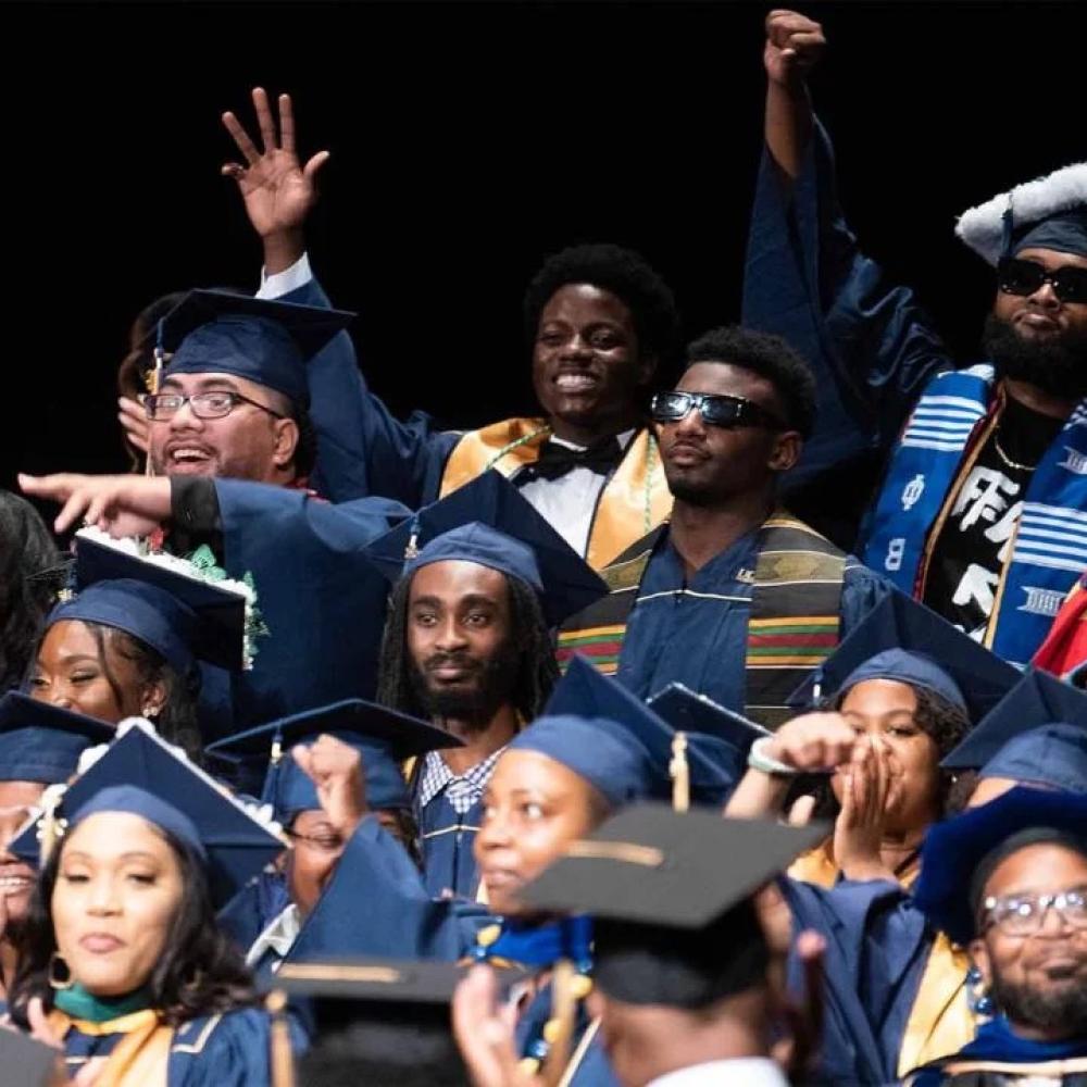 Group of students at black graduation ceremony.
