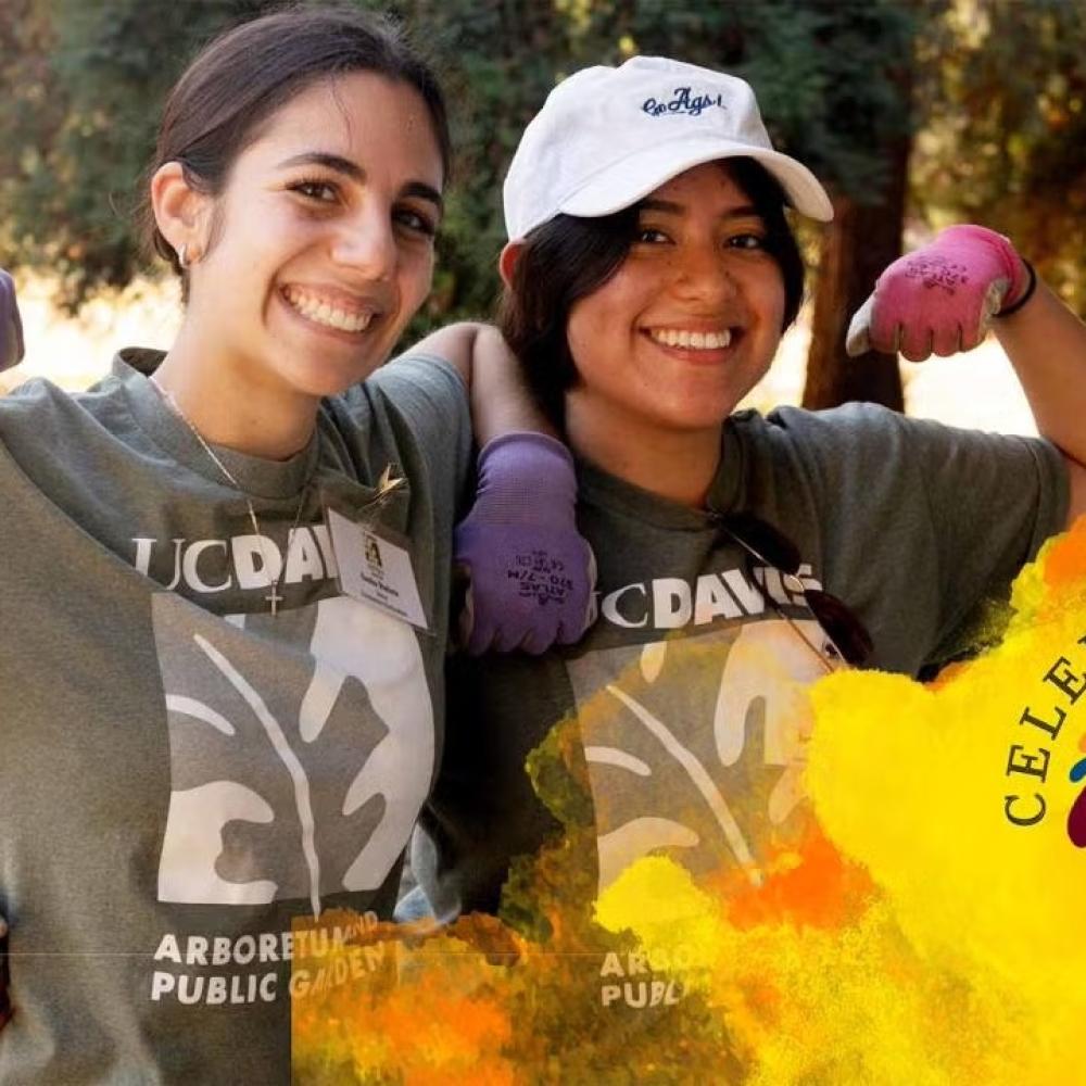 Two women wearing UC Davis Arboretum t-shirts each raise one arm to show strength. Their other arm is linked around the other person's waist. in corner of image is spiral of colors with Celebrating 35 years over a golden watercolor graphic.