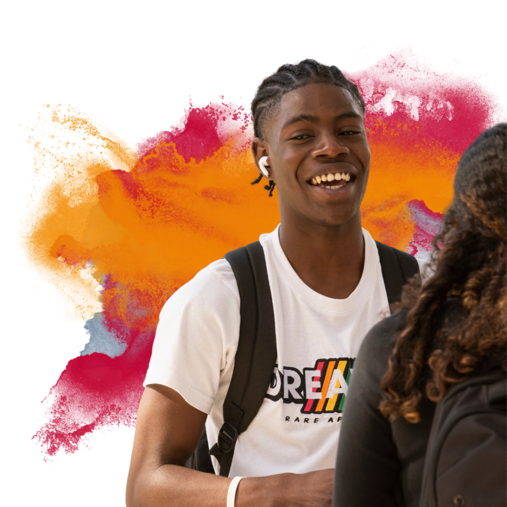 a student in white shirt smiling