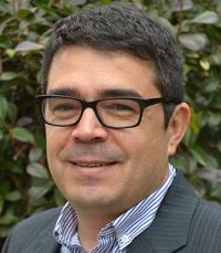 Dr. Luis Carvajal-Carmona wearing glasses