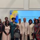 Doreen Joseph, Vice Chancellor Renetta Garrison Tull and Chancellor May stand with a group of about 30 people at Aggie Resilience event
