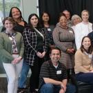 Attendees of the Womxn in Tech March 2024 event stand together.