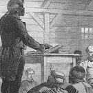Black-and-white illustration of an African American man standing at a podium addressing a seated group of Black and white individuals in a wooden meeting house, symbolizing a historical moment of teaching or gathering during the Reconstruction era.