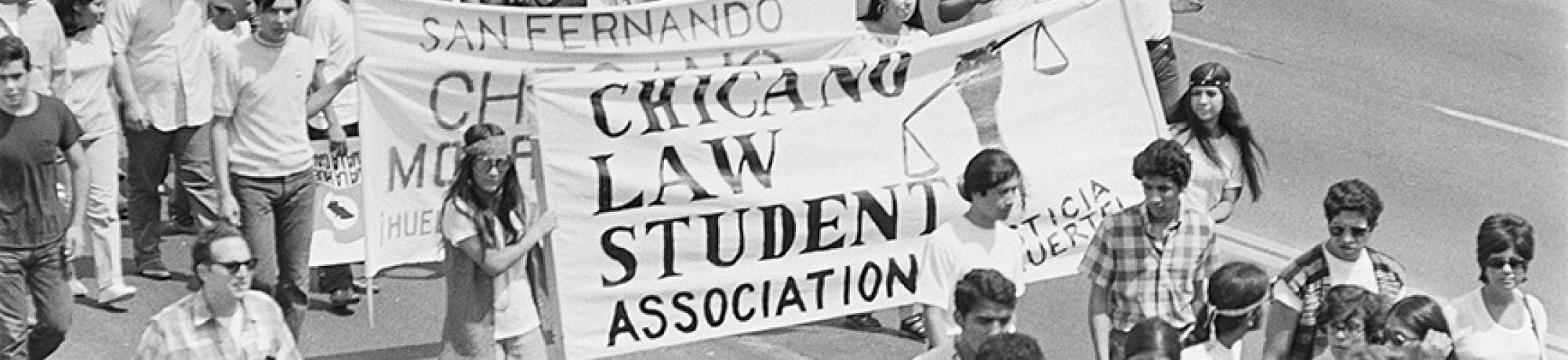 Protesters marching on Whittier Boulevard hold a banner that reads "Chicano Law Students Association" during the National Chicano Moratorium.